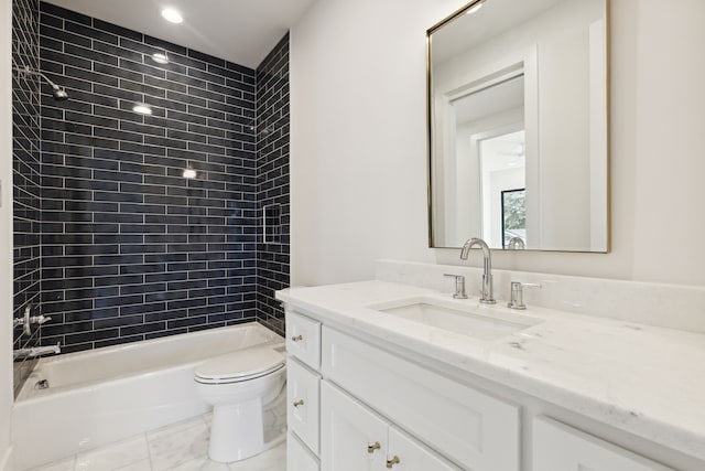 full bathroom featuring tile patterned floors, tiled shower / bath combo, toilet, and vanity