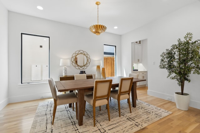 dining area featuring light wood-type flooring