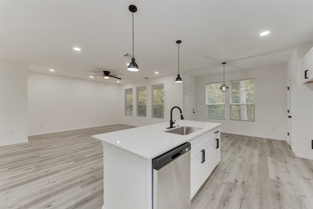 kitchen with an island with sink, white cabinets, sink, and stainless steel dishwasher