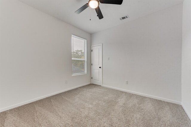 carpeted empty room with ceiling fan