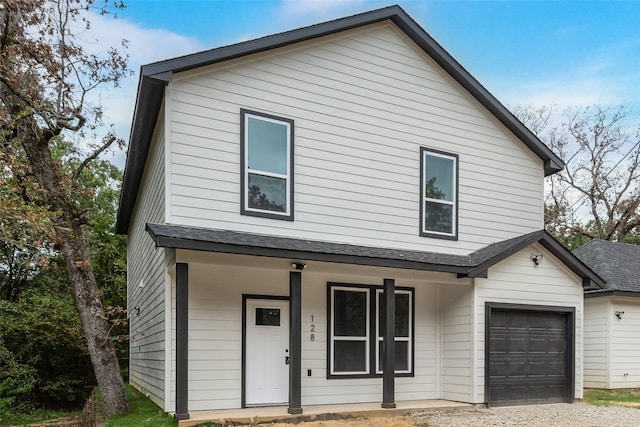 view of front of home featuring a garage and covered porch