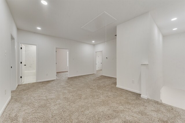 empty room featuring light colored carpet