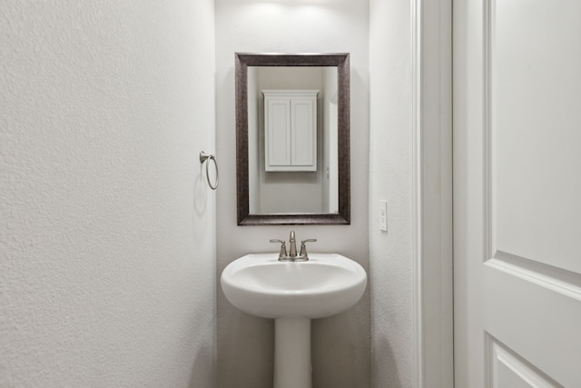 bathroom with a textured wall