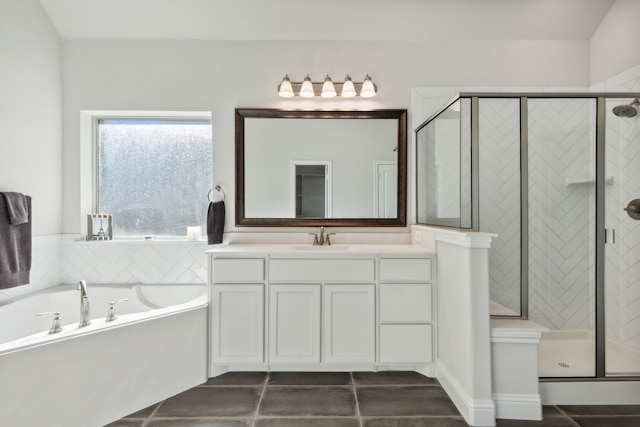 bathroom featuring independent shower and bath, vanity, and tile patterned floors