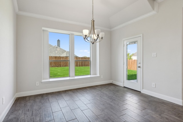 unfurnished dining area with ornamental molding, an inviting chandelier, dark wood finished floors, and baseboards