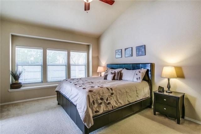 bedroom with vaulted ceiling, light carpet, and ceiling fan