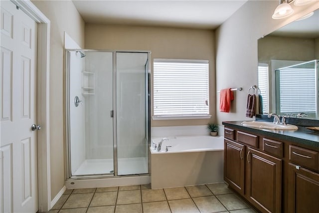 bathroom featuring vanity, separate shower and tub, and tile patterned floors