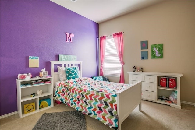 bedroom with light colored carpet