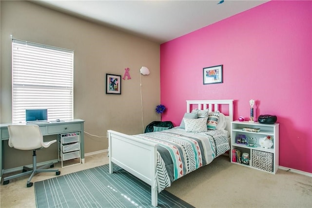 bedroom with carpet flooring and multiple windows