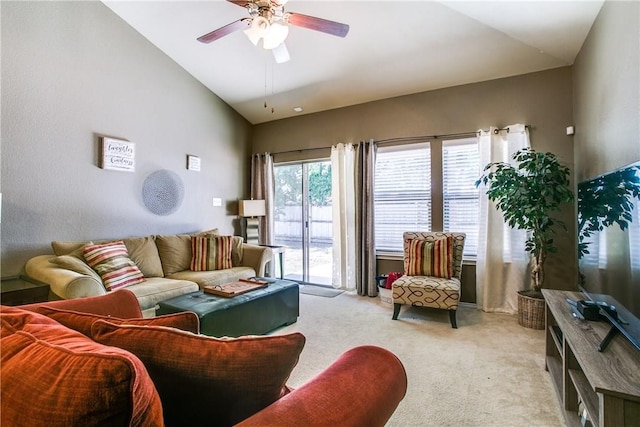 living room featuring light carpet, vaulted ceiling, and ceiling fan