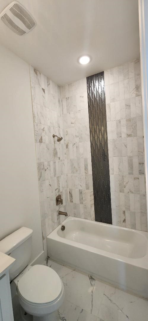 3338 Sylvan Ave, Dallas, TX 75212 - bathroom with shower / bath combination, marble finish flooring, vanity, and recessed lighting