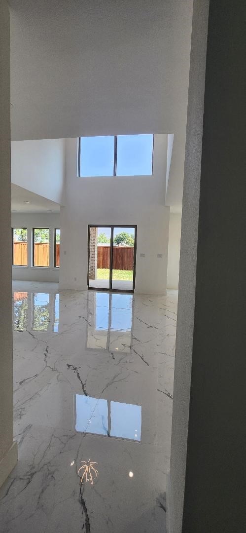 interior space with a textured ceiling and plenty of natural light