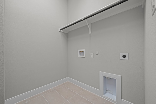 laundry area featuring hookup for a gas dryer, light tile patterned floors, hookup for an electric dryer, and washer hookup