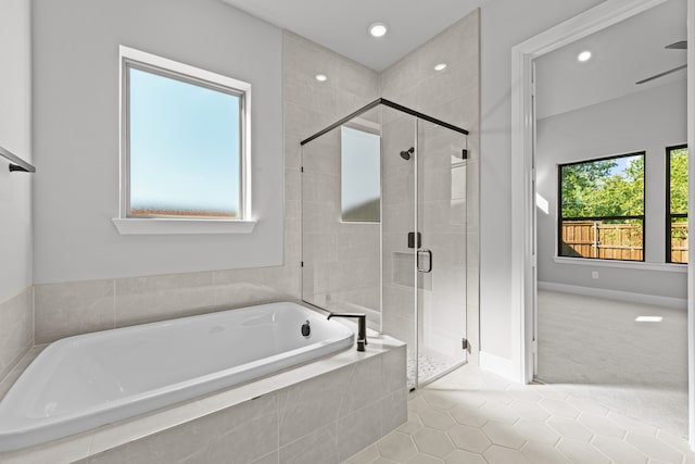 bathroom featuring plus walk in shower and tile patterned floors