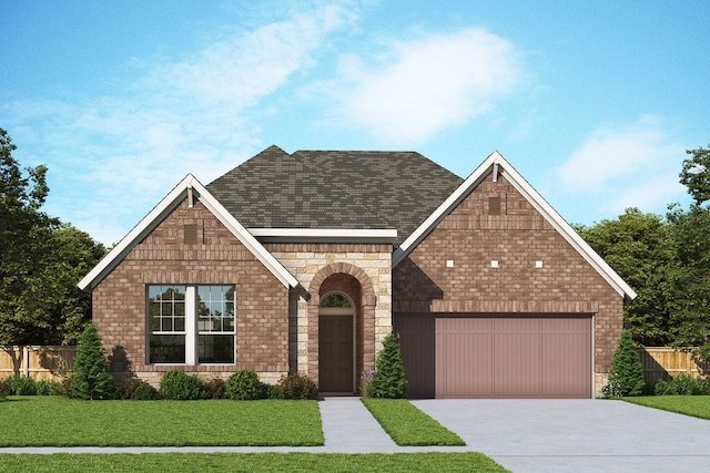 view of front of home featuring a garage and a front yard