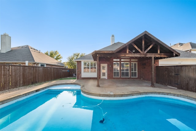 view of swimming pool with a patio