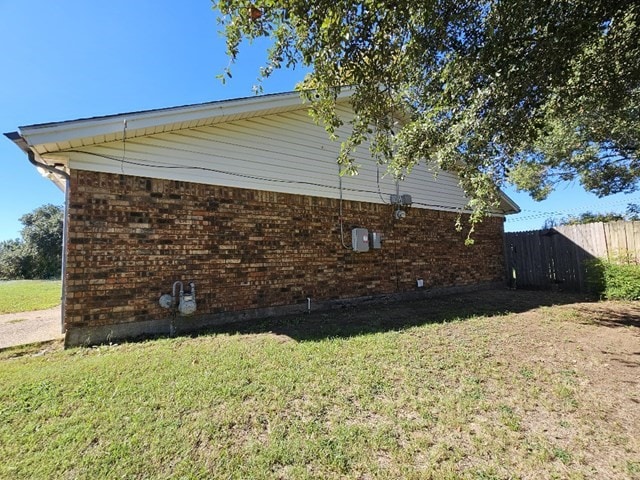 view of home's exterior with a yard