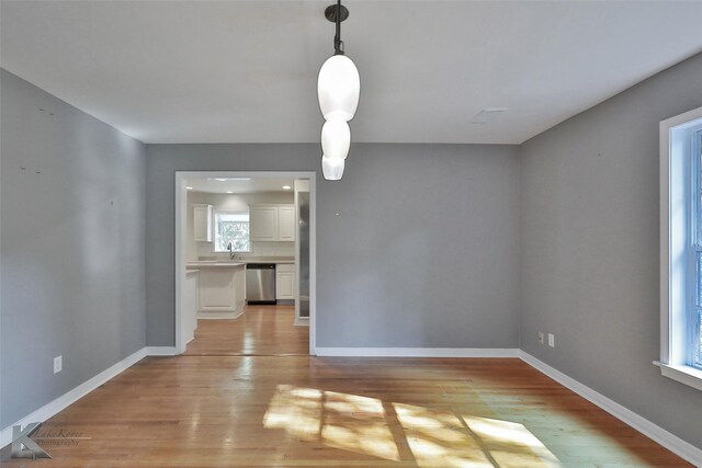 interior space with light wood-type flooring and sink