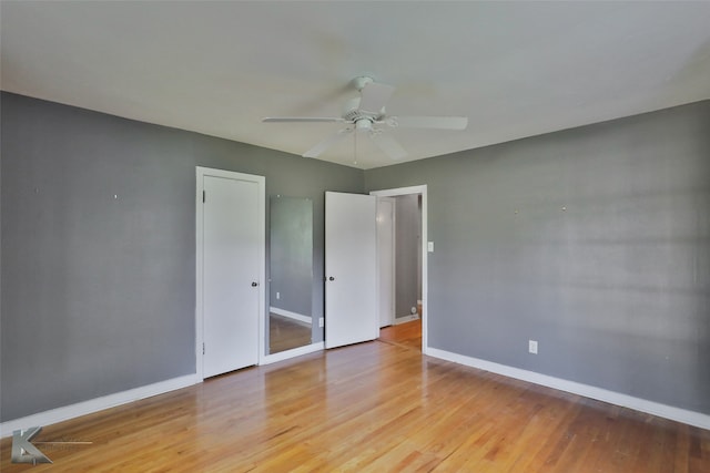 unfurnished bedroom with light wood-type flooring and ceiling fan