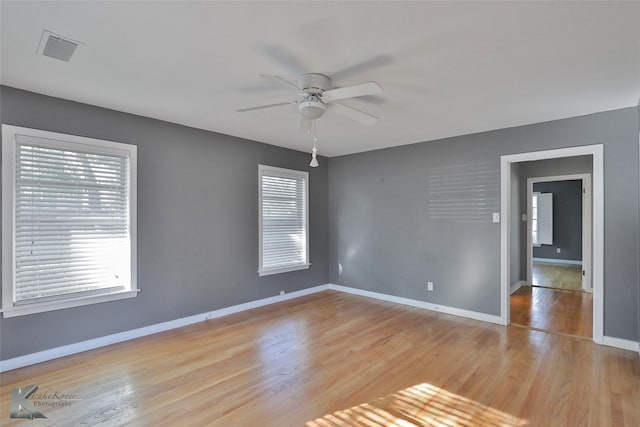 unfurnished room featuring light hardwood / wood-style floors and ceiling fan