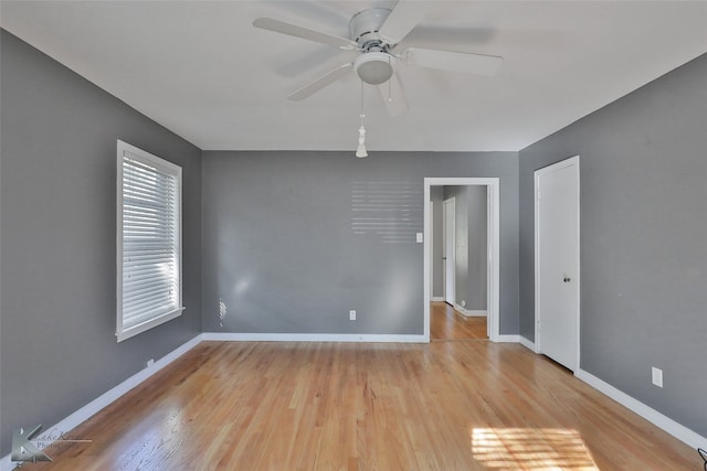 spare room with light hardwood / wood-style floors and ceiling fan