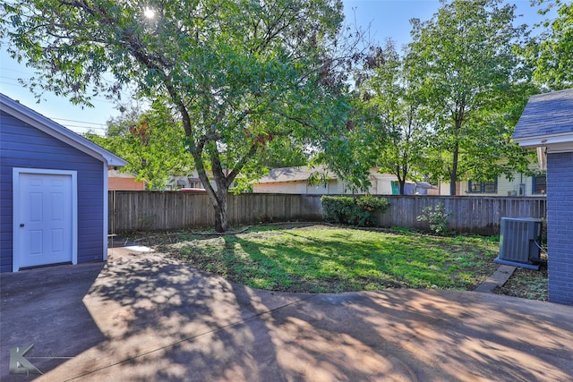 view of yard featuring a patio and central AC