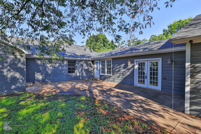 view of yard featuring french doors and a patio