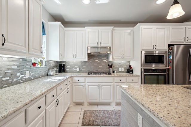 kitchen with white cabinetry, pendant lighting, and stainless steel appliances