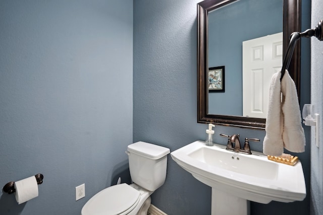 bathroom featuring sink and toilet