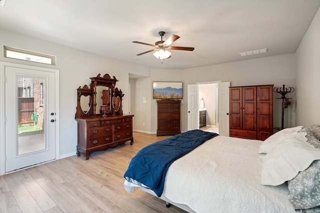 bedroom with light hardwood / wood-style floors, ceiling fan, ensuite bathroom, and access to exterior