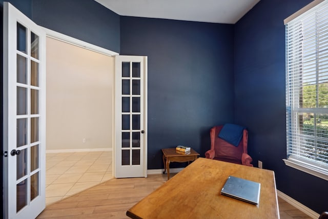 office featuring hardwood / wood-style floors and french doors