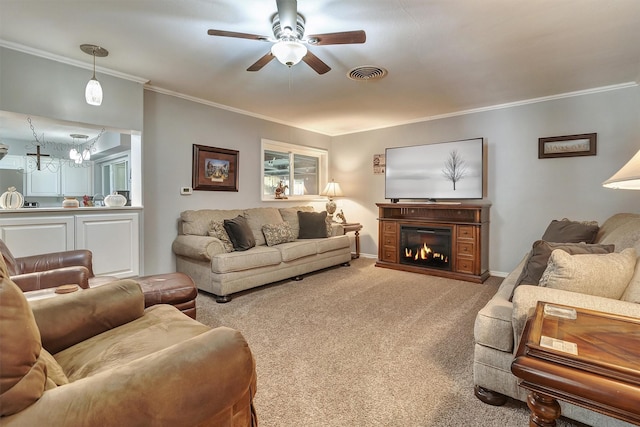 living room featuring crown molding, ceiling fan, and light colored carpet