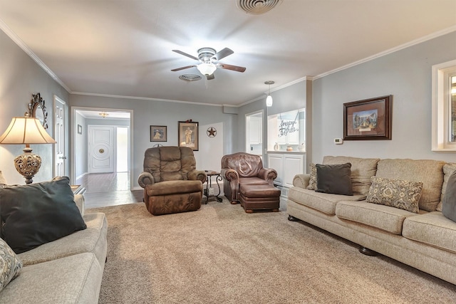 living room with ceiling fan, carpet floors, and crown molding