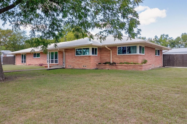 ranch-style house with a front lawn