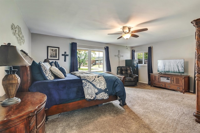 bedroom featuring ceiling fan and carpet