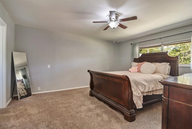 bedroom with ceiling fan and carpet floors