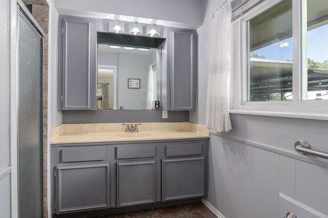 bathroom with vanity and walk in shower