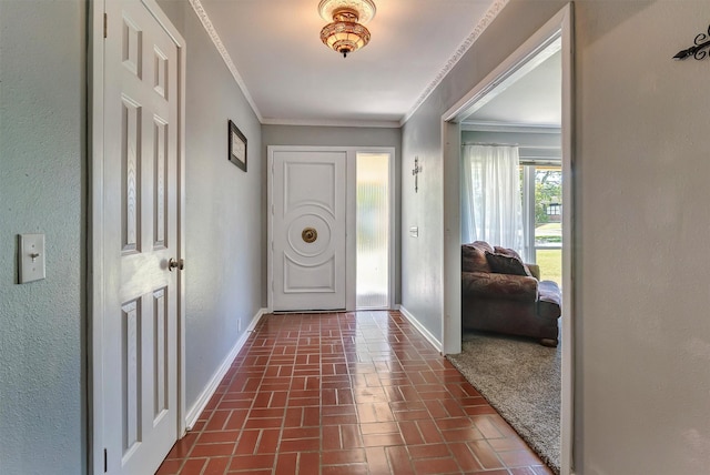 foyer featuring ornamental molding