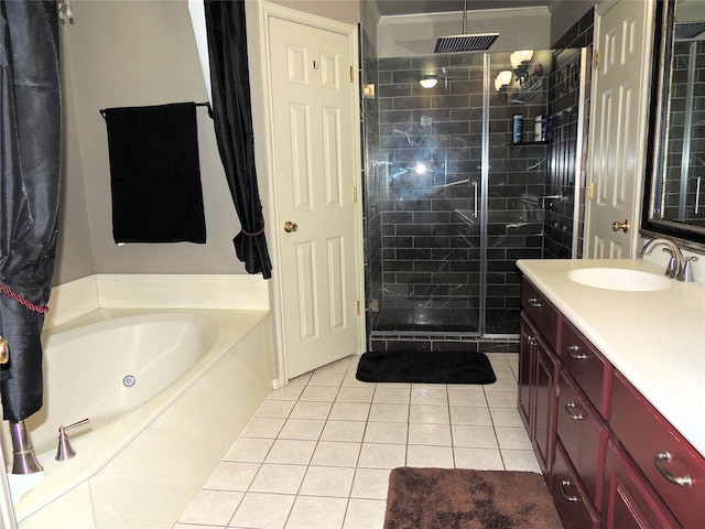 bathroom with shower with separate bathtub, tile patterned flooring, and vanity