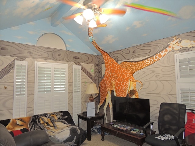 living room featuring ceiling fan, carpet floors, and lofted ceiling with beams