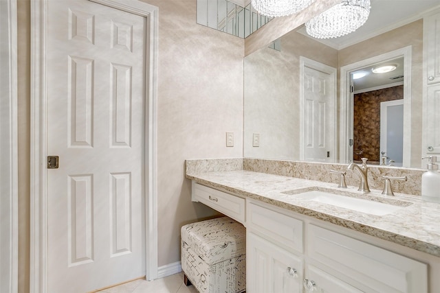 bathroom featuring crown molding, vanity, and tile patterned floors