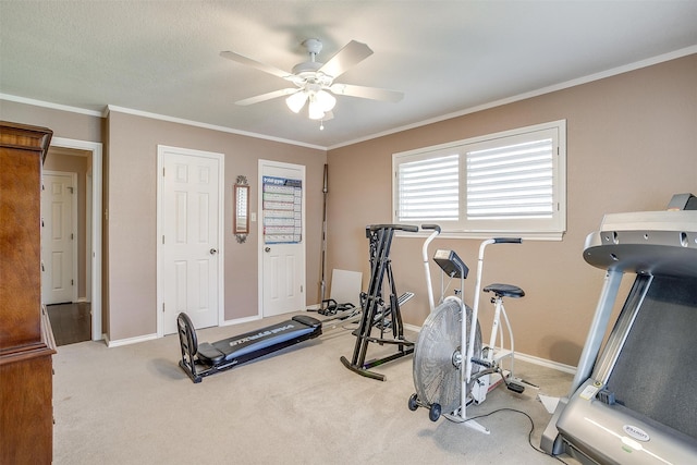 workout area with ornamental molding, carpet, and ceiling fan