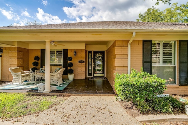 entrance to property featuring ceiling fan and a patio area