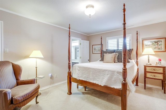 bedroom with carpet, ensuite bathroom, and crown molding