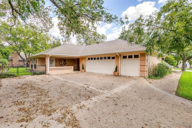 ranch-style home featuring a garage