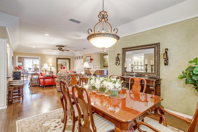 dining room featuring ceiling fan and hardwood / wood-style flooring