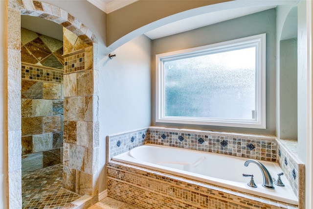 bathroom featuring shower with separate bathtub and ornamental molding