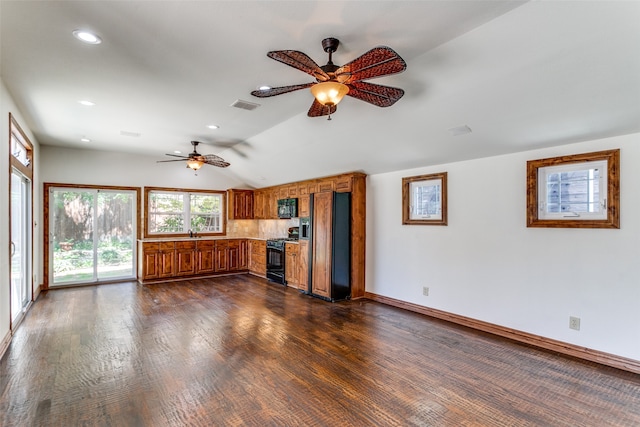 unfurnished living room featuring lofted ceiling, dark wood-type flooring, ceiling fan, and sink