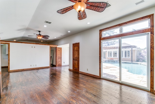 spare room featuring ceiling fan, lofted ceiling, and dark hardwood / wood-style flooring