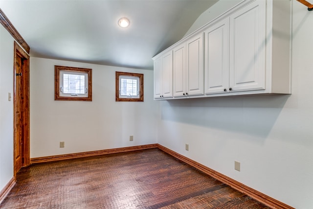 empty room featuring dark wood-type flooring